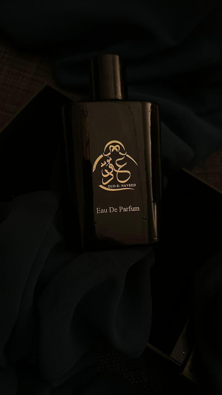 Oud e Naveed bottle resting on velvet